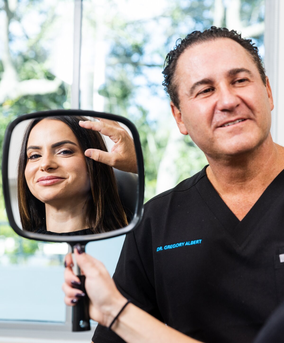 Doctor and patient looking in mirror