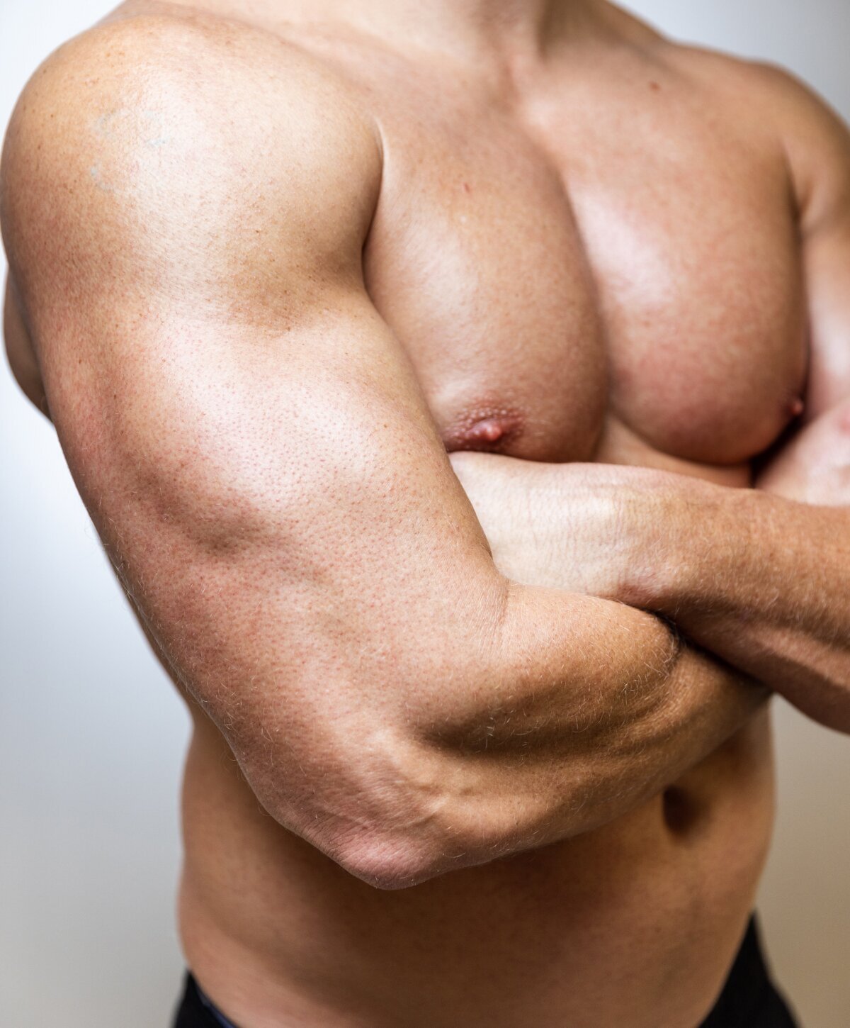 Boca Raton Male Plastic Surgery model showing muscles